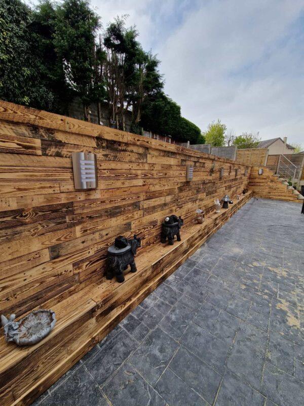 reclaimed scorched pallet wood used as a fence